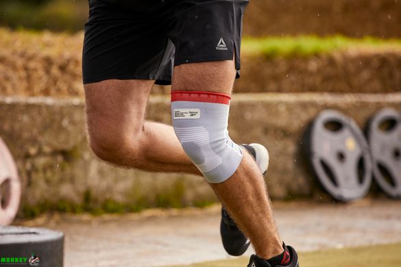 Фіксатор коліна Reebok Speedwick Knee Support білий, червоний Уні L