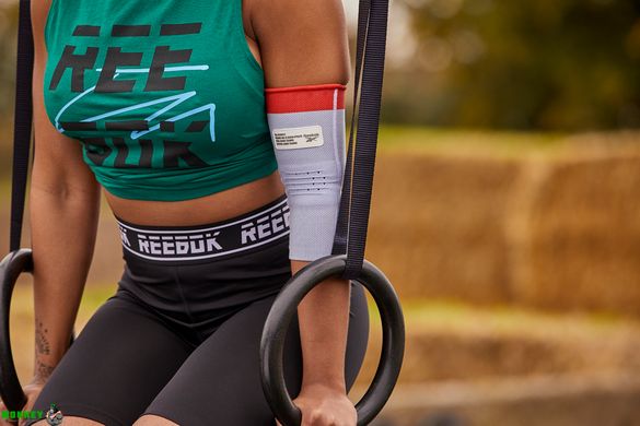 Фіксатор ліктя Reebok Speedwick Elbow Support білий, червоний Уні L